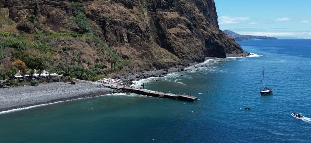 Fajã dos Padres beach club at the base of the cliffs