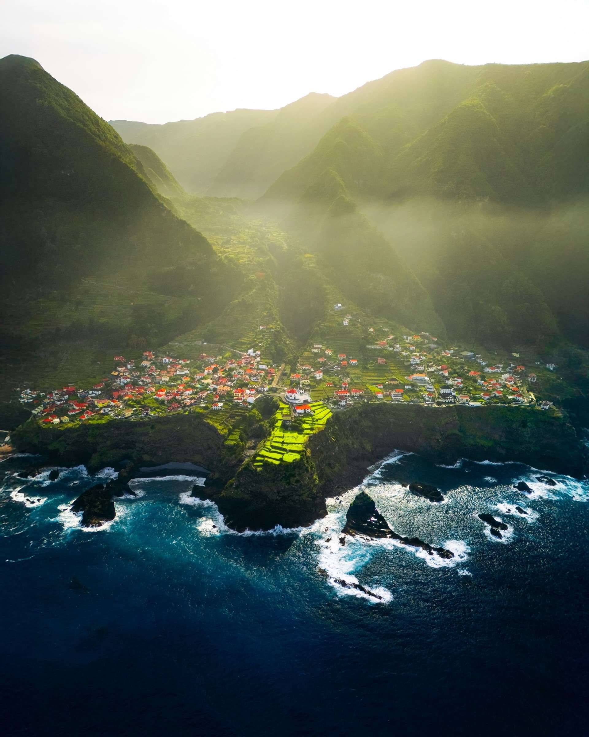 Aerial view of a Madeira coastal village in golden light